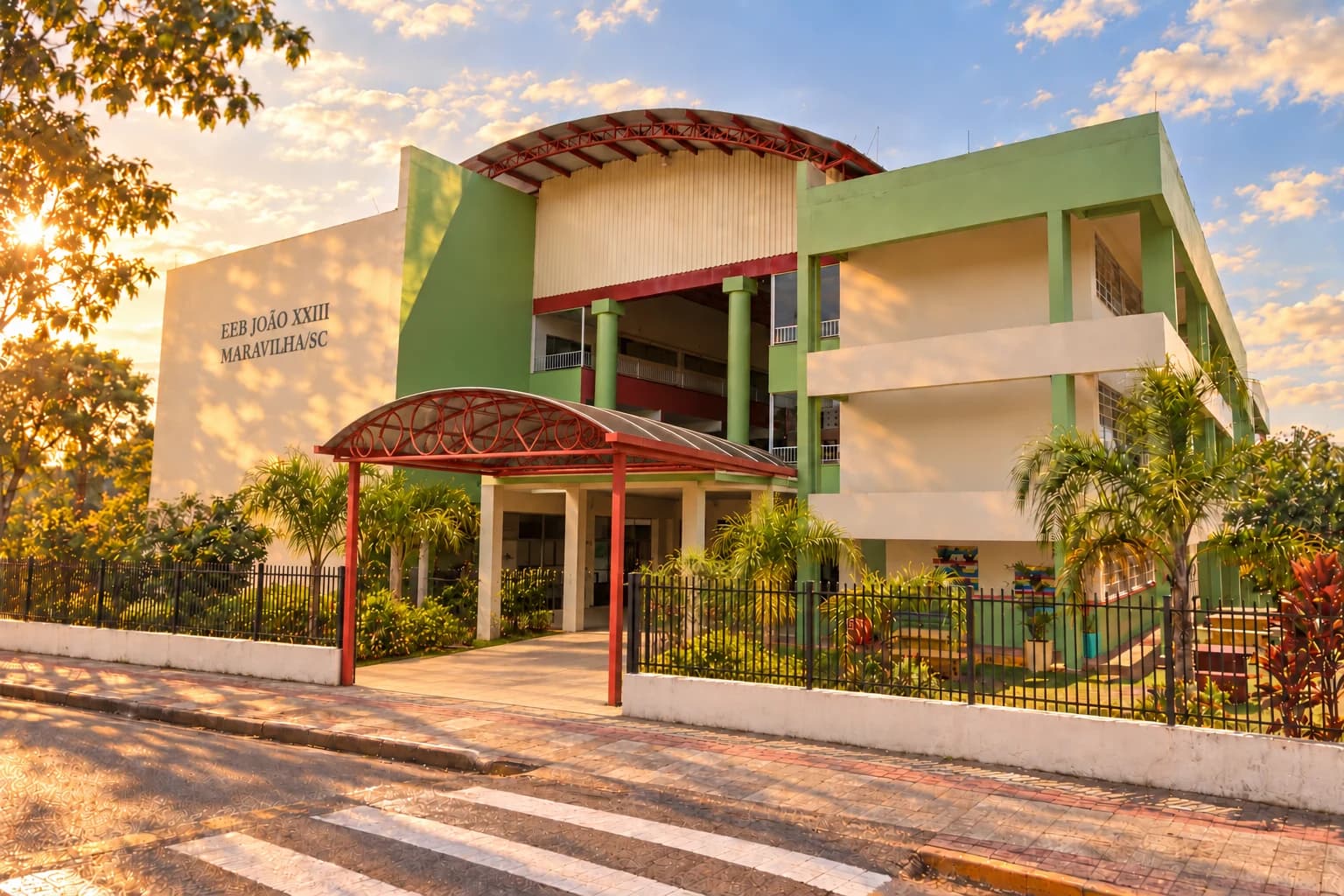 Recriação artística da EEB João XXIII: fachada verde e creme e hall livre sob cobertura curva com pilares vermelhos.